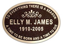 Oval bronze memorial plaque with scroll detail