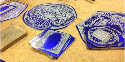 In-process etched zinc plates for championship belts