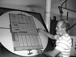 PEC team member working on etching a plaque