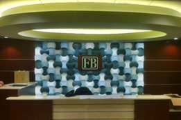 Magnesium plaque with silver letters installed on mosaic wall in First Bank lobby