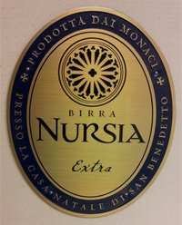 Oval-shaped zinc plaque replicating Birra Nursia label