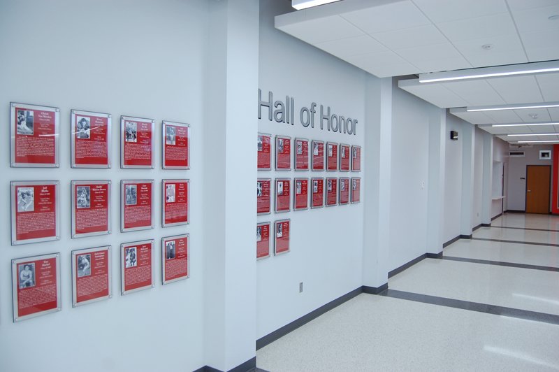 Central College Hall of Honor hallway with aluminum lettering and red plaques