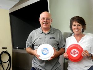 Ronda Pope and Jackie pose with flying discs