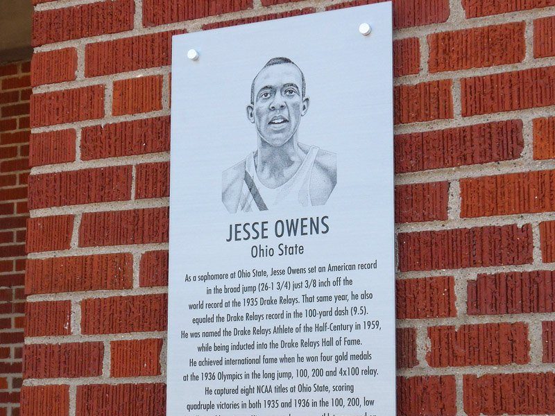 Closeup of Jesse Owens zinc plaque with portrait and biography