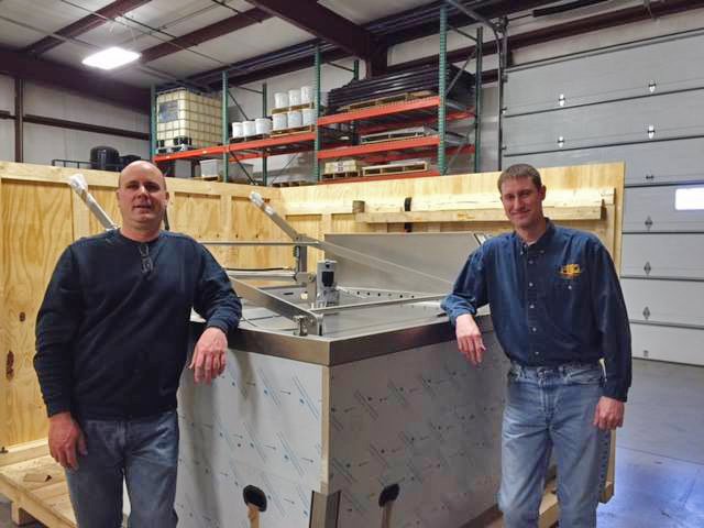 Bernd and Jeff pose with new etcher in PEC workshop