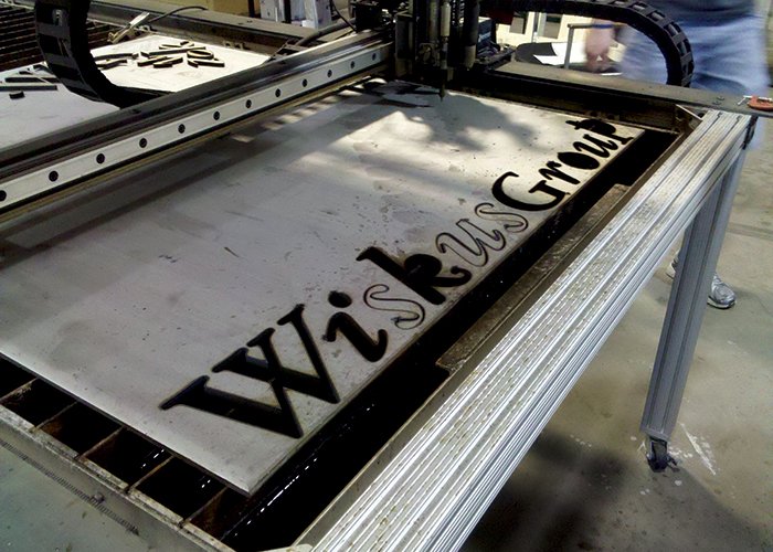 Wiskus lettering being cut out by CNC router