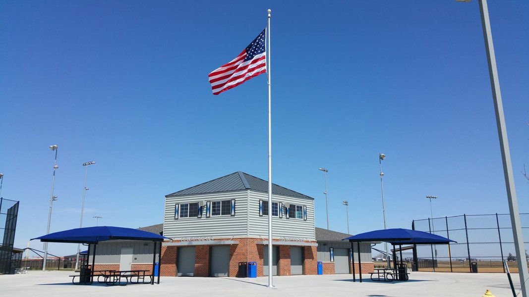 Concession stand at Pella Sports Park with American flag flying in front