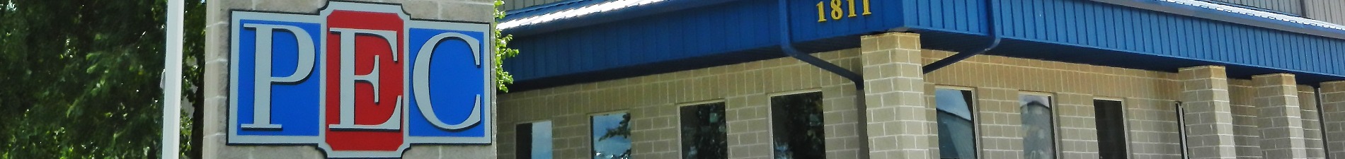 Header image of PEC storefront sign with building in background