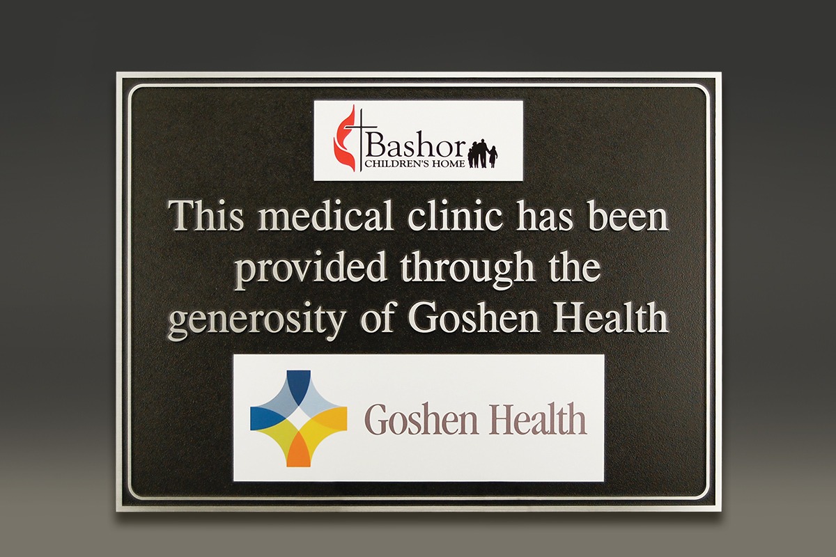 Black Goshen Health plaque with UV-printed logos