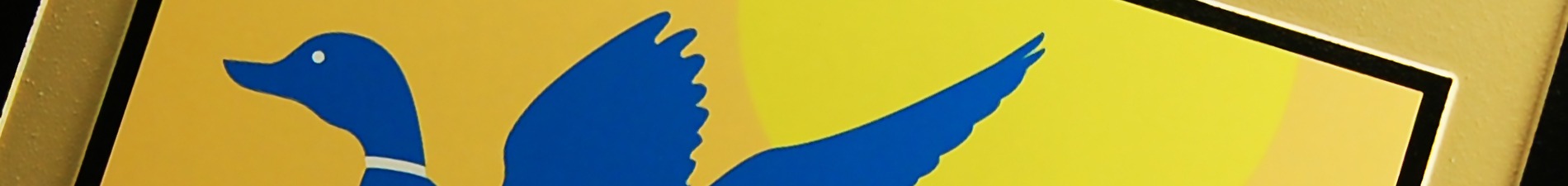 Header image closeup of plaque with UV-printed, blue and yellow seal of U.S. Fish & Wildlife Service