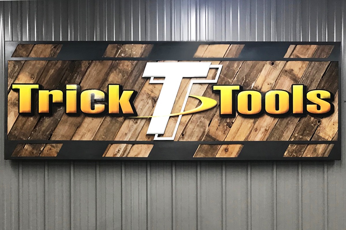 Rustic wood wall sign for Trick Tools